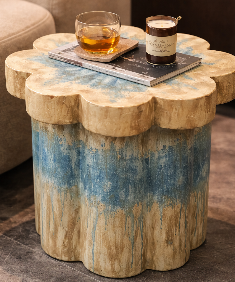 Decorative side table with a floral design in a living room setting.