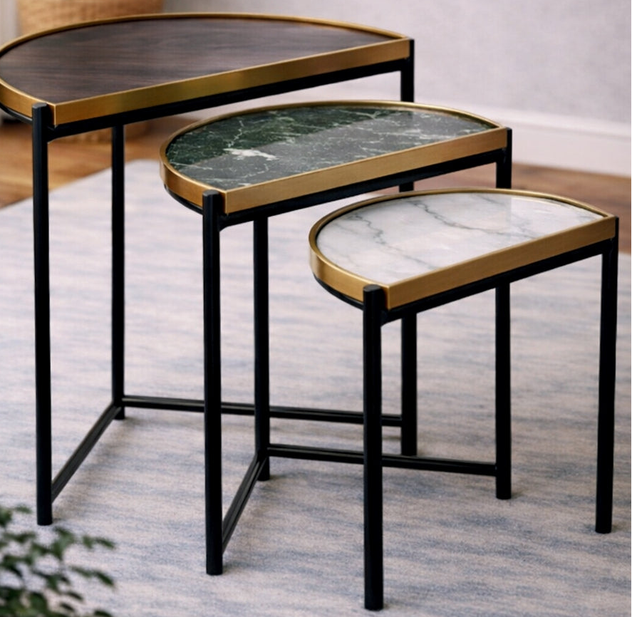 Set of three nesting tables with marble-like tops on a rug