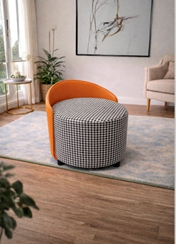 Round ottoman with checkered pattern and orange backrest in a living room setting.