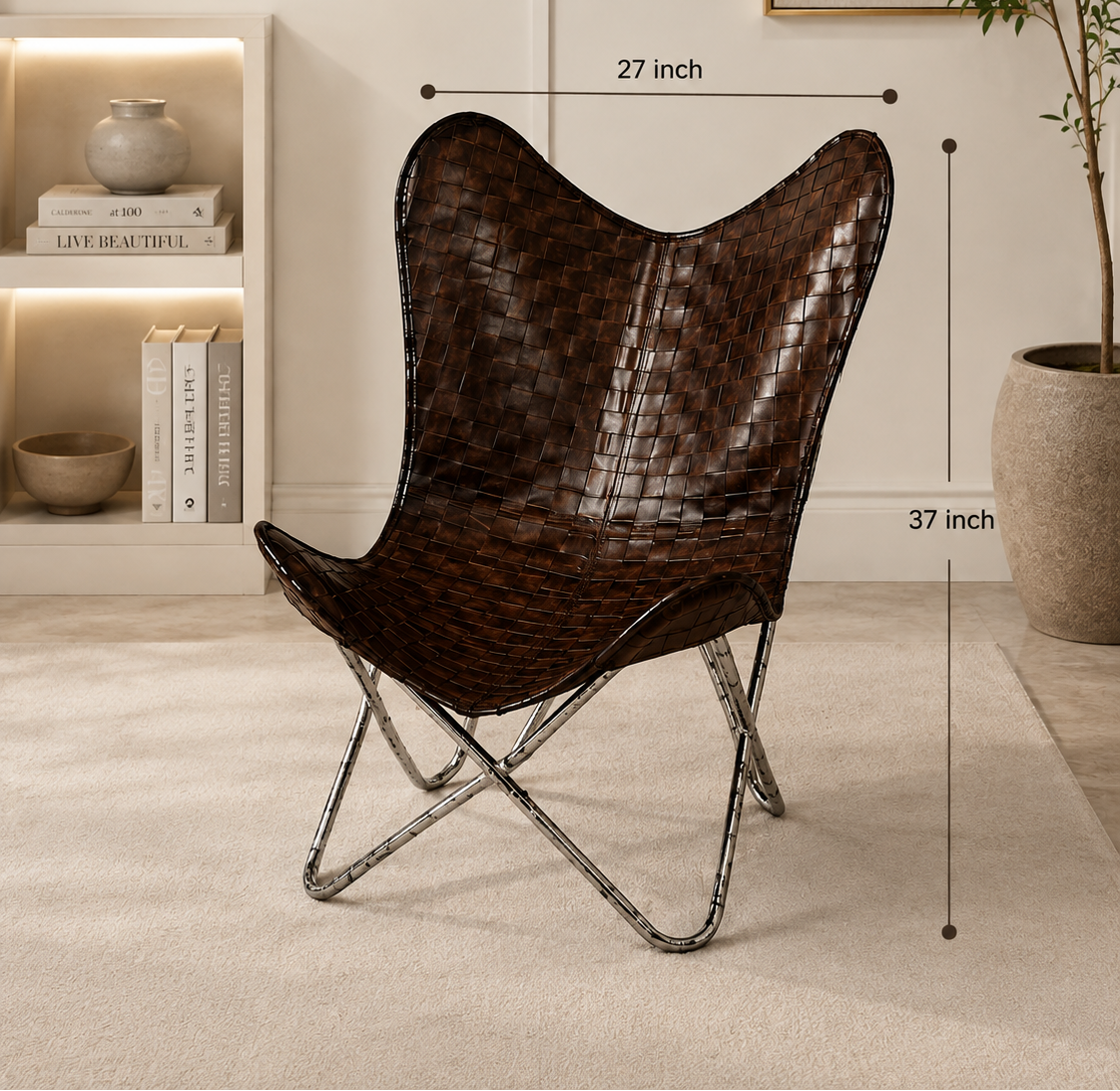 A butterfly-style chair with a dark brown woven leather seat and back, supported by a black metal frame, shown in a styled room setting with dimension lines indicating 27 inch width and 37 inch height.