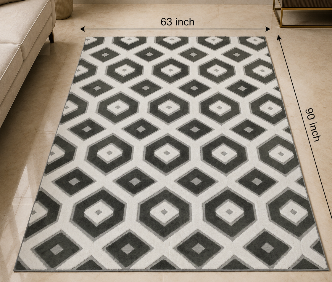 A rectangular area rug with a black, gray, and white geometric diamond pattern, shown in a styled living room setting with dimension lines indicating 63 inches by 90 inches. The brand name 'DSYN' is visible at the top.