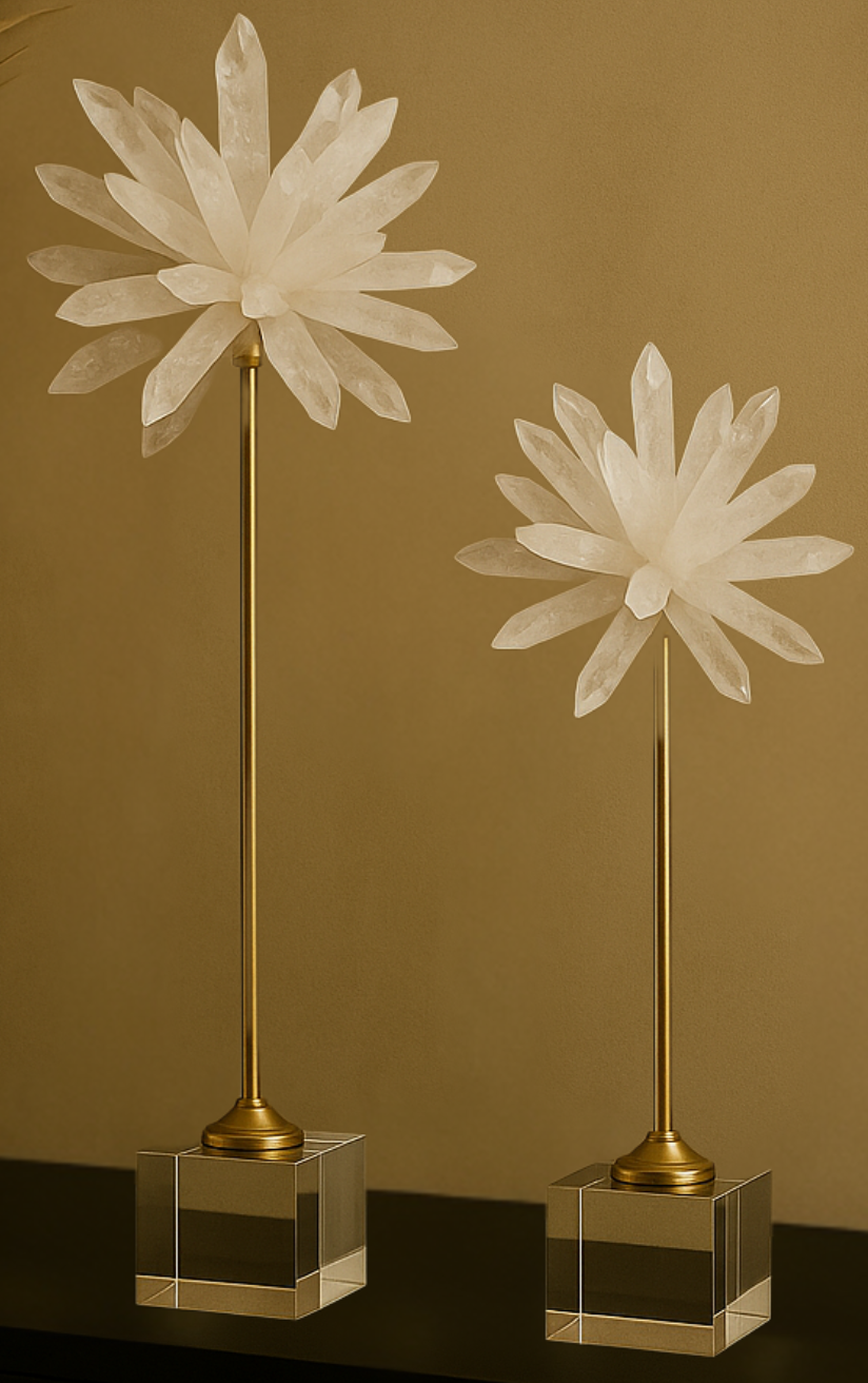 Two decorative lamps with floral designs on gold stands against a brown background
