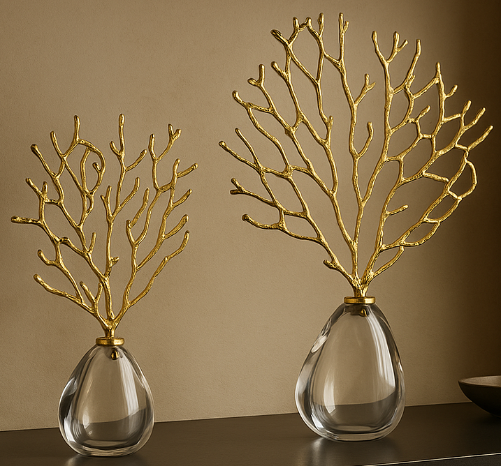 Two decorative vases with gold branch-like structures on a neutral background