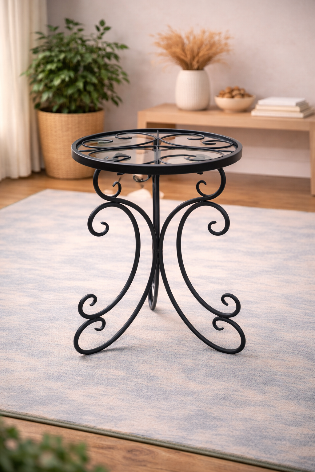 Decorative black metal side table in a living room setting with a rug and plants.