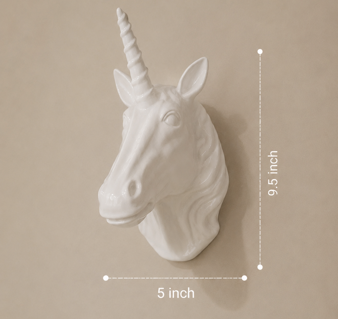 White unicorn head wall decoration with measurements on a beige background