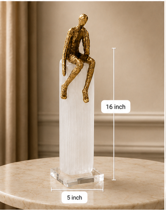 Four views of a gold sculpture on a white pedestal with measurements indicated.