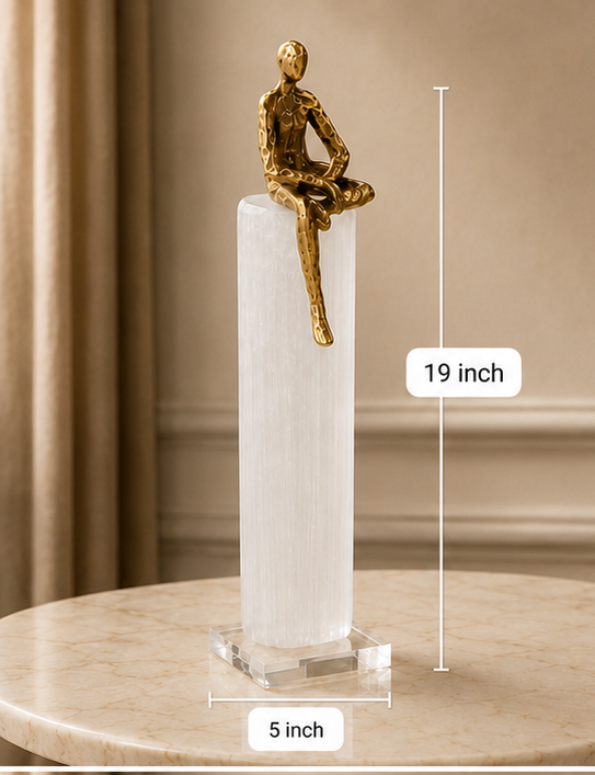 Four views of a gold sculpture on a white pedestal with measurements indicated.