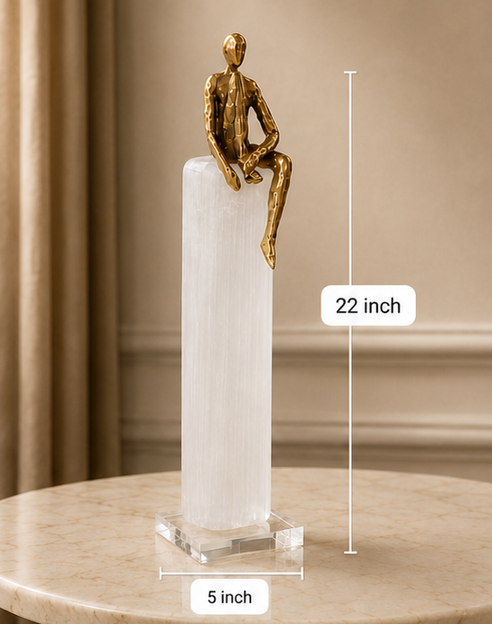 Four views of a gold sculpture on a white pedestal with measurements indicated.
