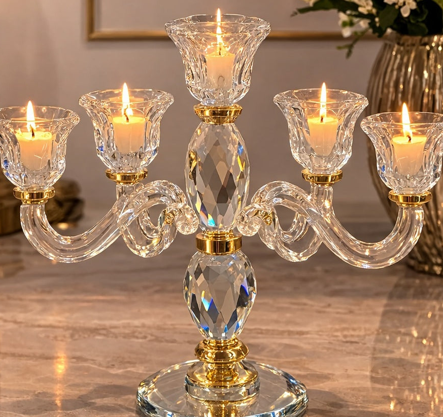 Crystal candelabrum with five candle holders on a reflective surface.