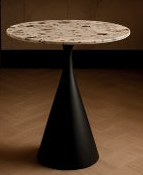 Modern black table with a round marble top in a room with a sofa and decorative vases.