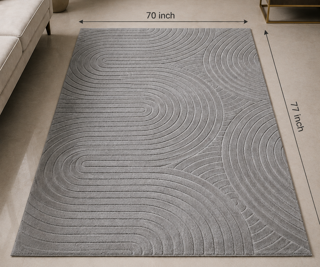 A gray rectangular area rug with a raised wavy geometric pattern, shown in a styled living room setting. The image includes dimension lines indicating the rug is 70 inches by 77 inches, along with the brand name 'DSYN' and feature icons at the bottom.